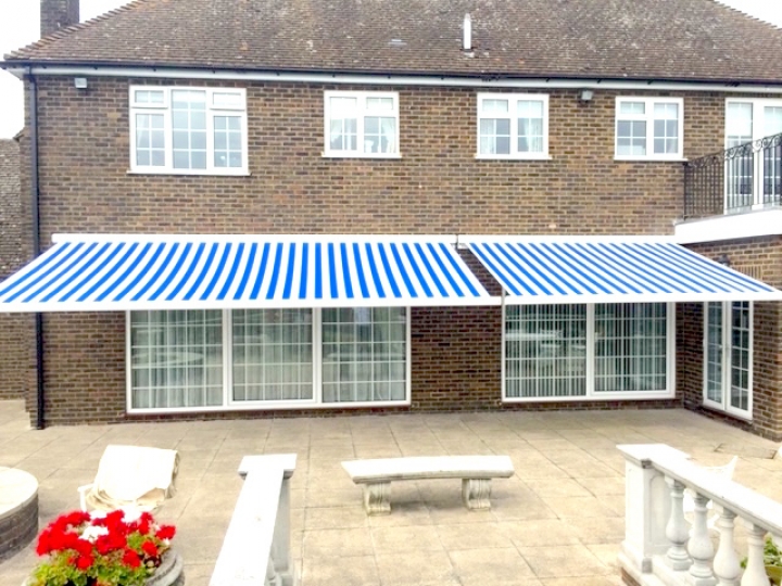 Remote control motorised awning supplied and fitted in Cheshunt Blue and white striped awning, perfect for summer days and evenings