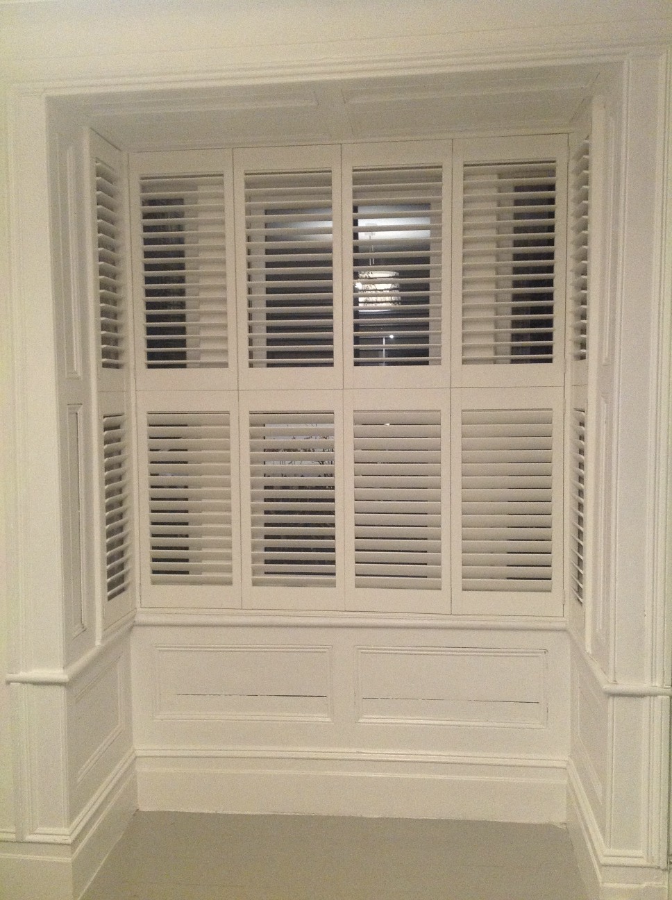Easy Tilt bi-folding tier on tier bay shutters  - Plantation shutters -  Carolina Blinds