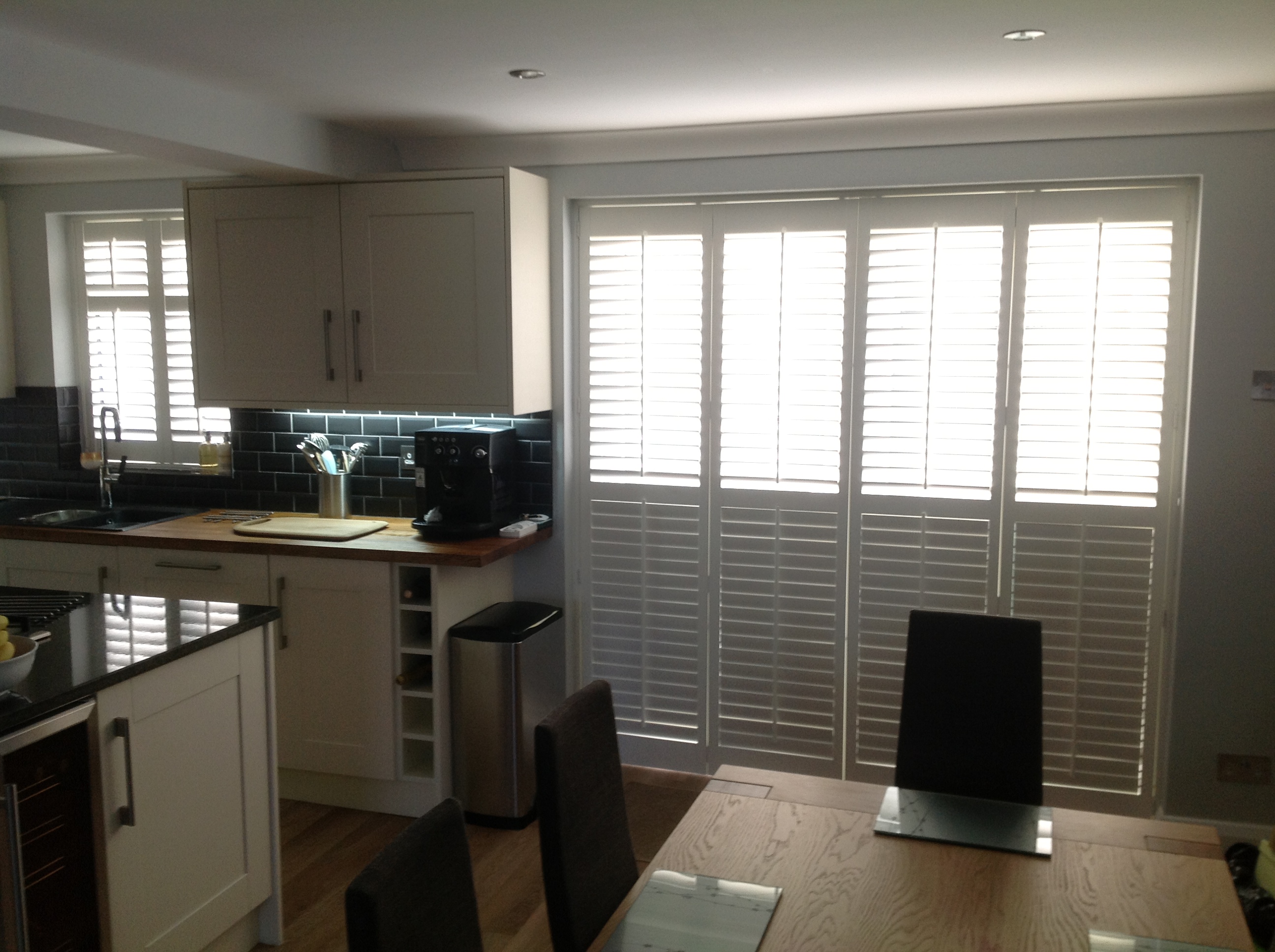 Bi Fold patio door shutters  - Plantation shutters -  Carolina Blinds