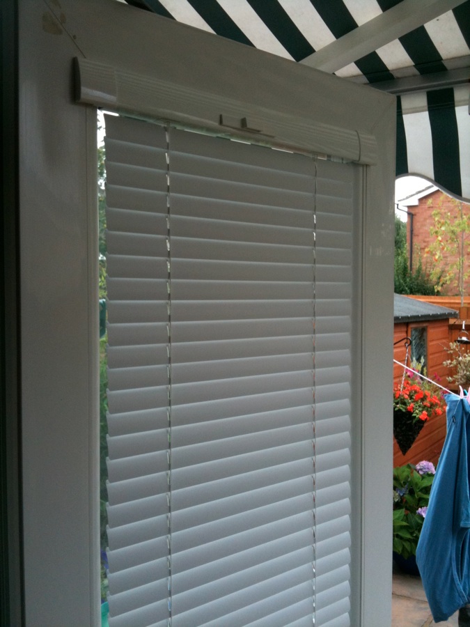Back door fitted with Intu perfect fit venetian blind in Hatfield Broard Oak  - Conservatory window blinds -  Carolina Blinds
