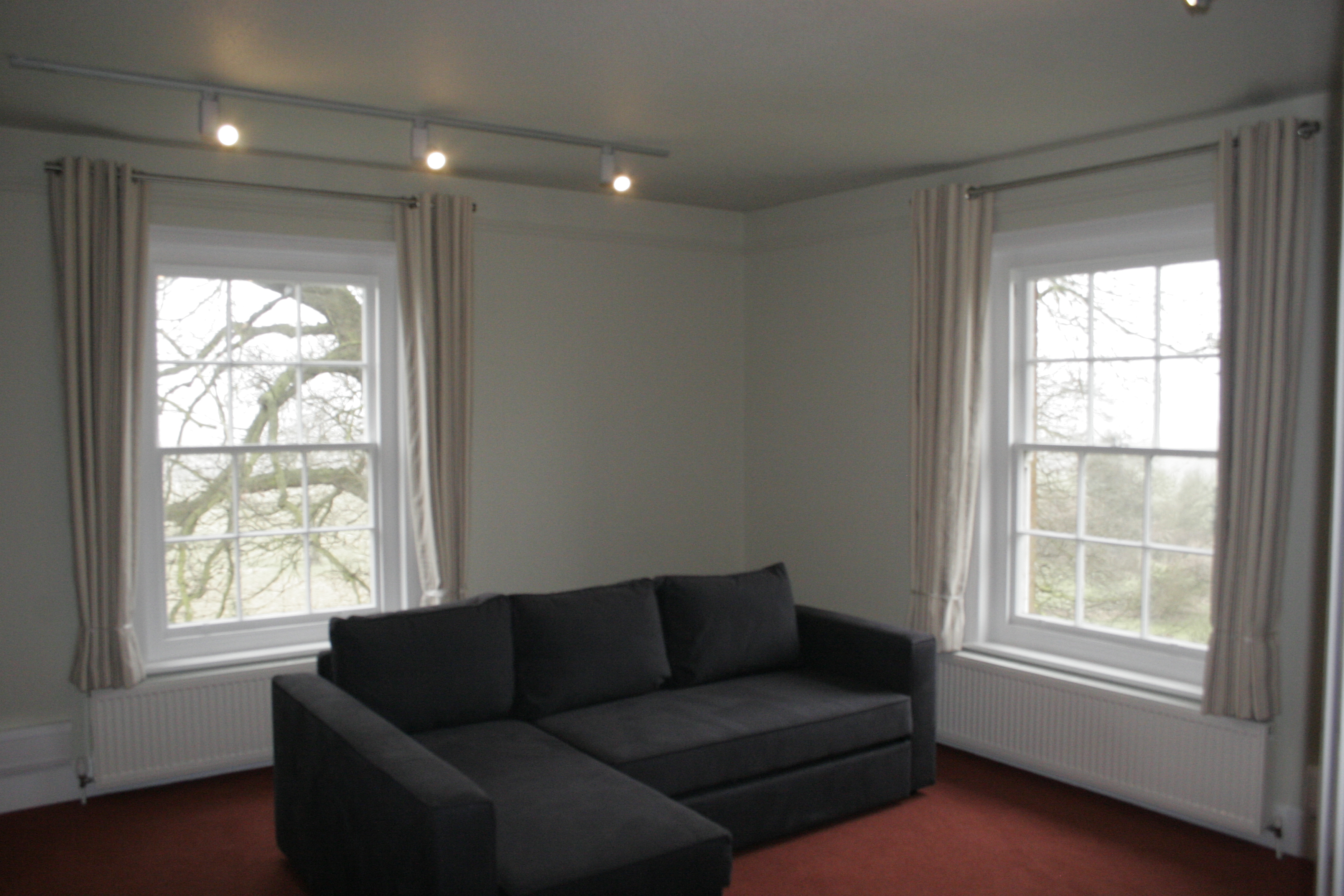 Eyelet curtains on chrome poles fitting in playroom in Bishops Stortford  - Soft furnishings -  Carolina Blinds